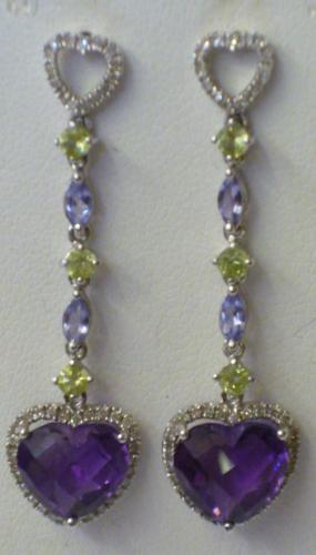 Appraisal: A PAIR OF AMETHYST PENDANT STUD EARRINGS the faceted heart