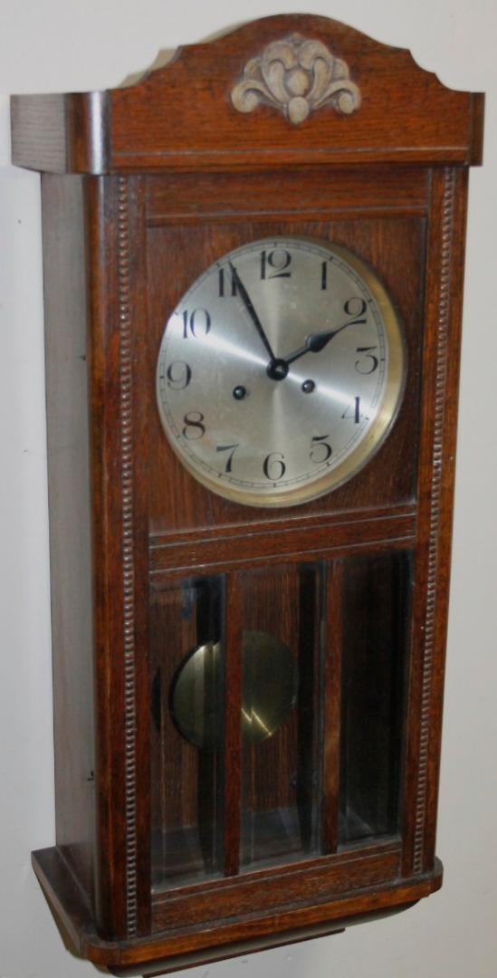 Appraisal: An early thC oak cased wall clock with silvered cm