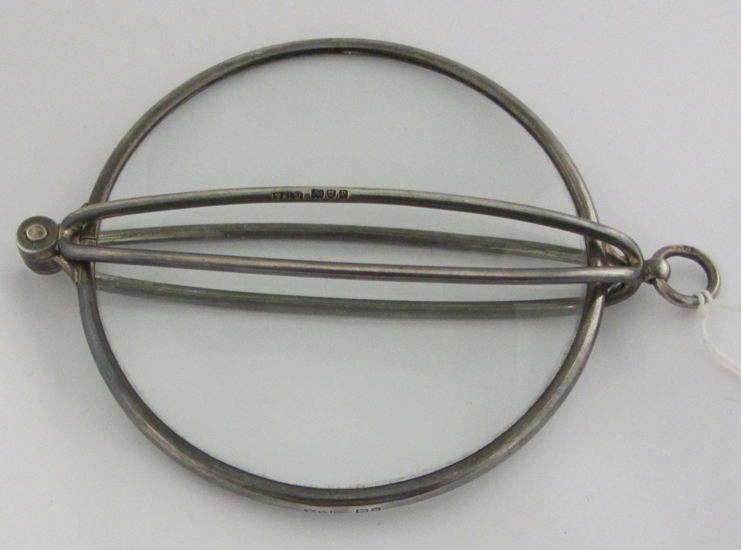 Appraisal: A silver mounted folding magnifying glass fitted with a circular