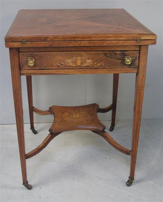 Appraisal: Edwardian rosewood and inlaid envelope card table with undershelf h