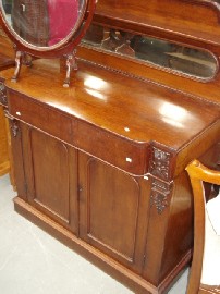 Appraisal: A Victorian mahogany chiffonier with mirrored back