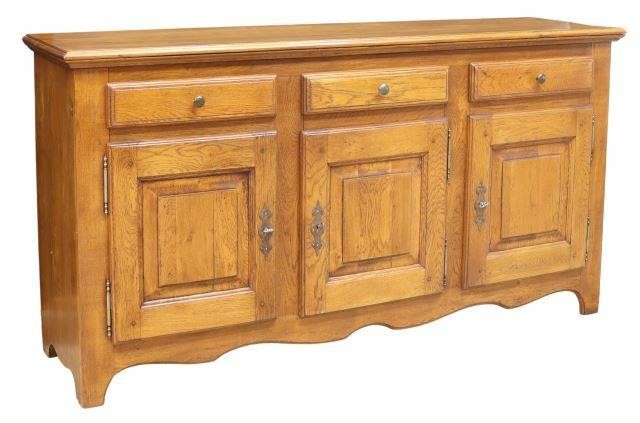 Appraisal: French Provincial oak sideboard th c the rectangular top over