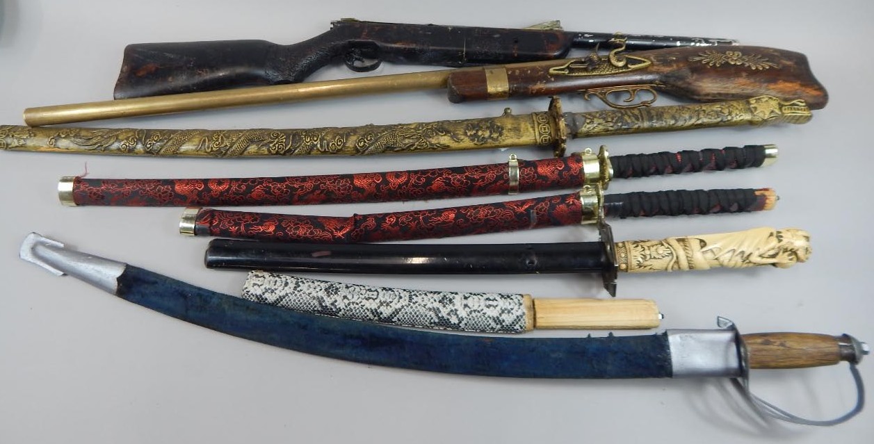 Appraisal: A collection of replica Oriental weapons comprising Katana Wakizashi and