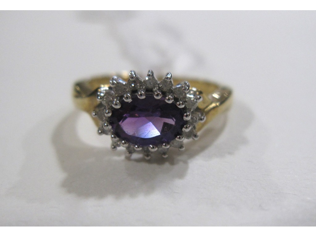 Appraisal: Nine carat gold amethyst and diamond cluster ring