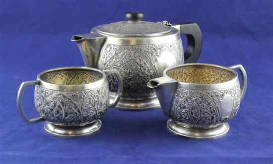 Appraisal: An Indian white metal three piece tea set of squat