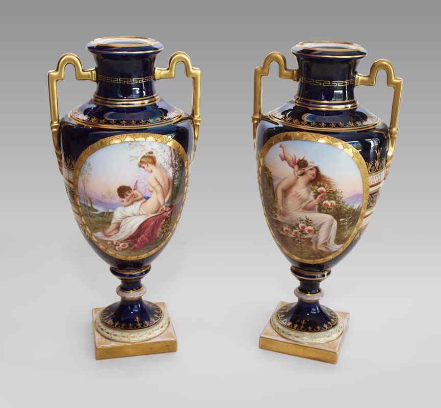 Appraisal: PAIR ARTIST SIGNED ROYAL VIENNA PORCELAIN VASES Cobalt ground rich