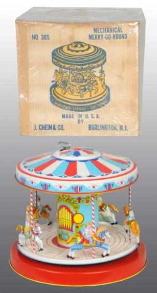 Appraisal: Tin Chein Merry-Go-Round Wind-Up Toy Description American Working Later version