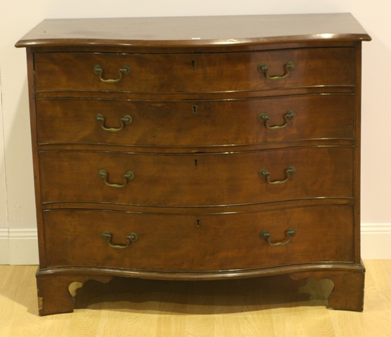 Appraisal: A George III mahogany serpentine chest of drawers restorations cm