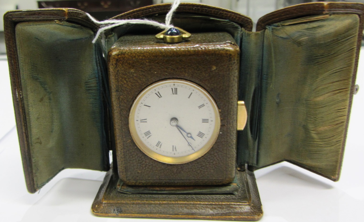 Appraisal: An early th century green leather cased minute repeating rectangular