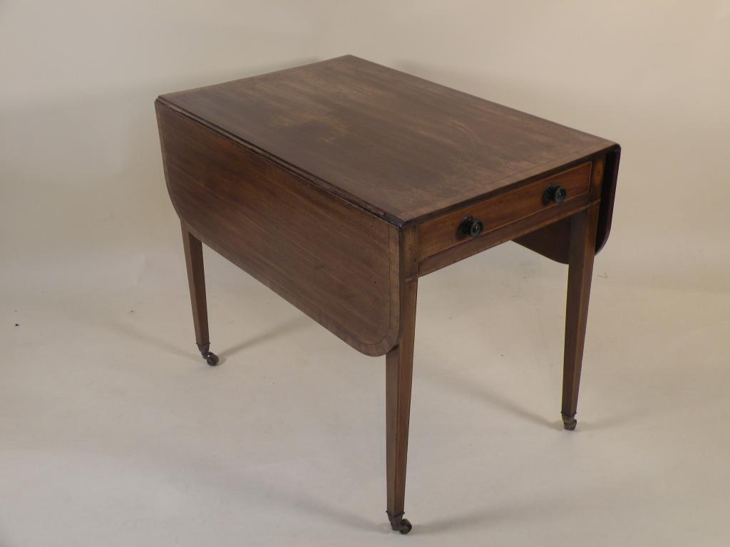 Appraisal: A George III mahogany pembroke table the rectangular cross banded