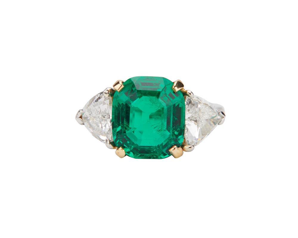 Appraisal: Platinum Emerald and Diamond Ring centering an emerald-cut emerald measuring