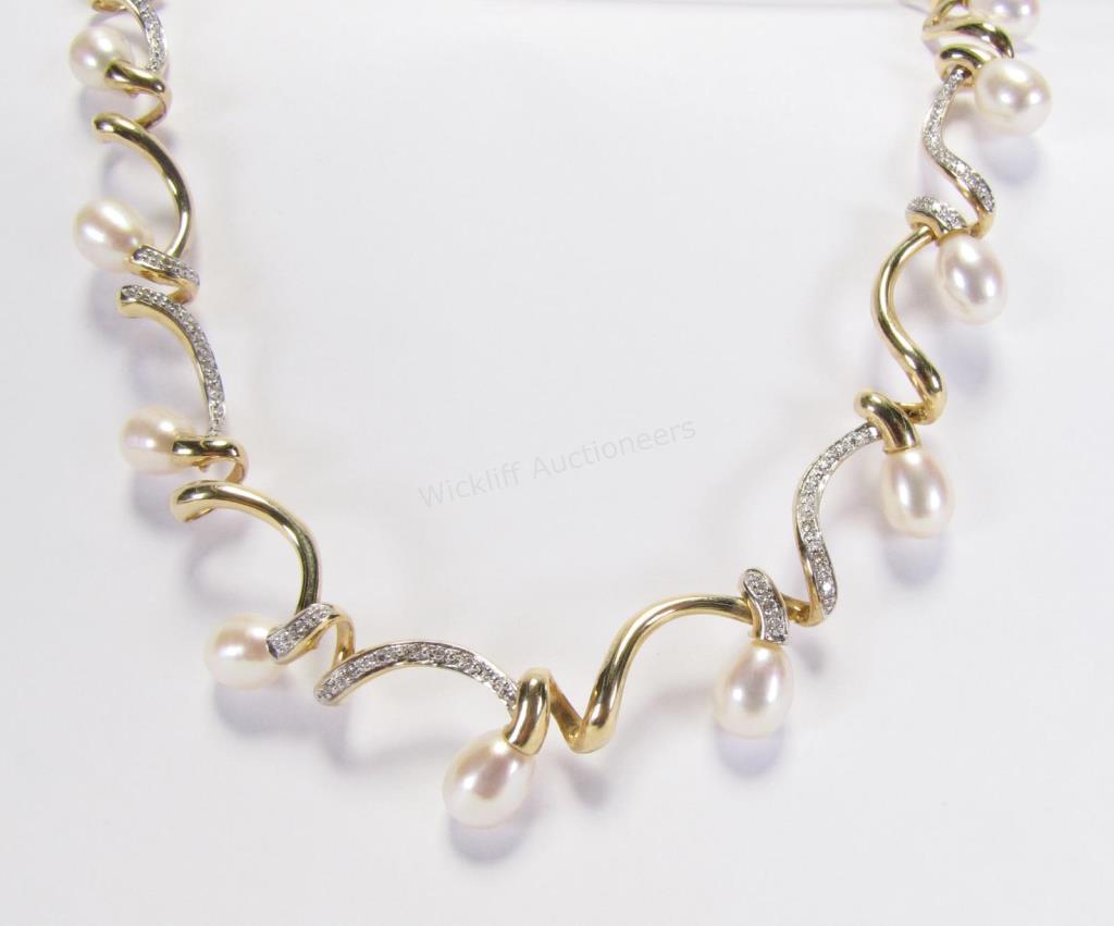 Appraisal: A K yellow gold Baroque cultured pearl and diamond accent