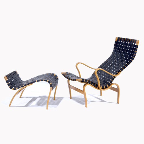 Appraisal: BRUNO MATHSSON Lounge chair and ottoman with black leather webbing