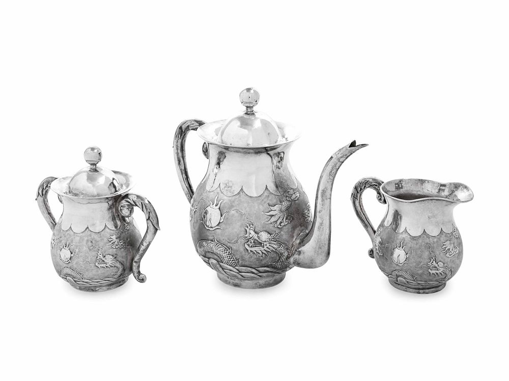 Appraisal: A Japanese Silver Three-Piece Tea Service A Japanese Silver Three-Piece