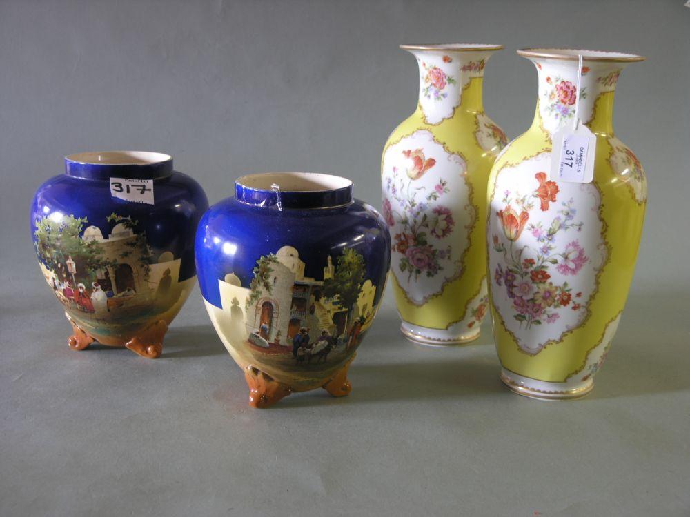 Appraisal: A pair of Austrian porcelain baluster vases brightly printed with