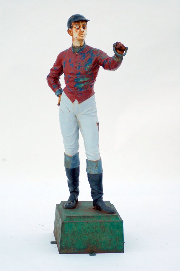 Appraisal: Cast iron lawn jockey red over blue paint to jacket