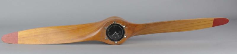 Appraisal: Wooden Propeller Hanging Wall Clock This wood propeller with Tensor