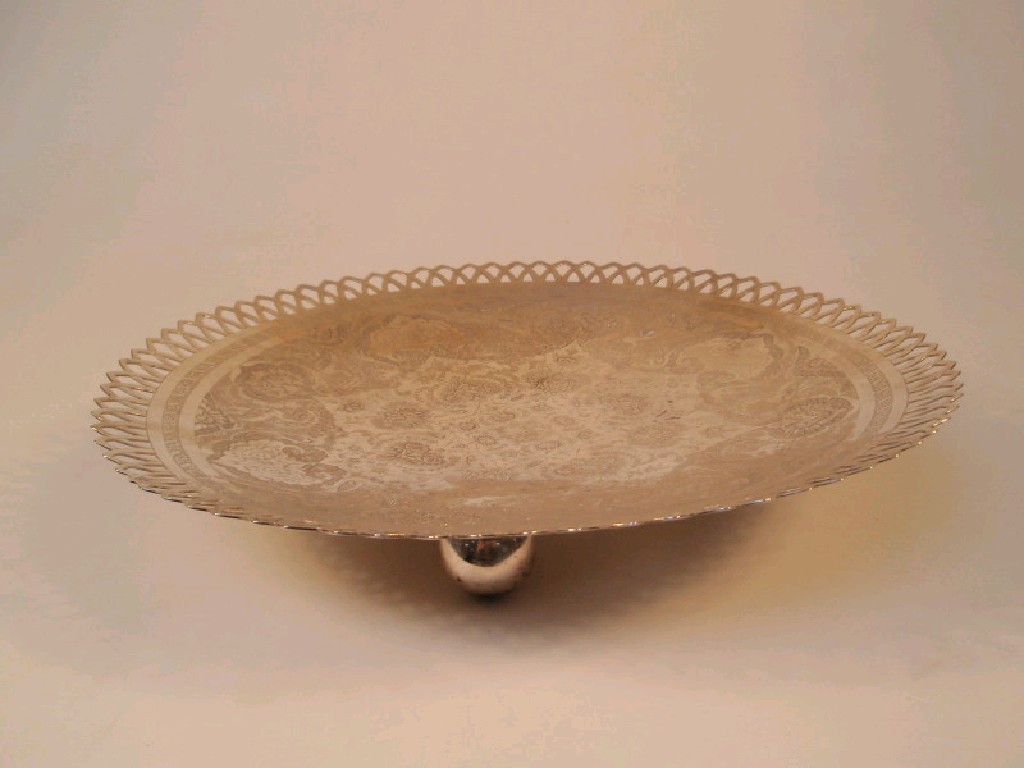 Appraisal: An Indian silver circular dish engraved overall with a Persian