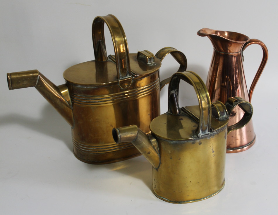 Appraisal: Two brass watering cans and a copper jug marked J