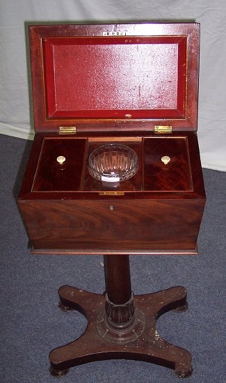 Appraisal: A Regency mahogany teapoy the rectangular hinged top with concave