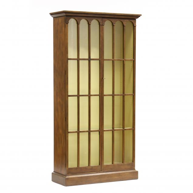 Appraisal: ATTRIBUTED BAKER TALL ITALIANATE LIGHTED CHERRY DISPLAY CABINET Mid- th