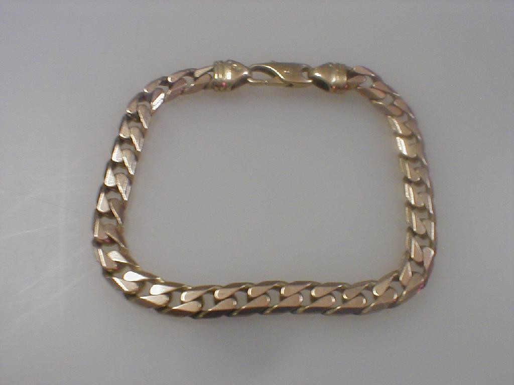 Appraisal: A gents curb link bracelet marked for ct g