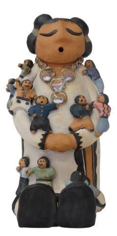 Appraisal: Native American pottery storyteller unsigned with eleven small figures flambe-glazed