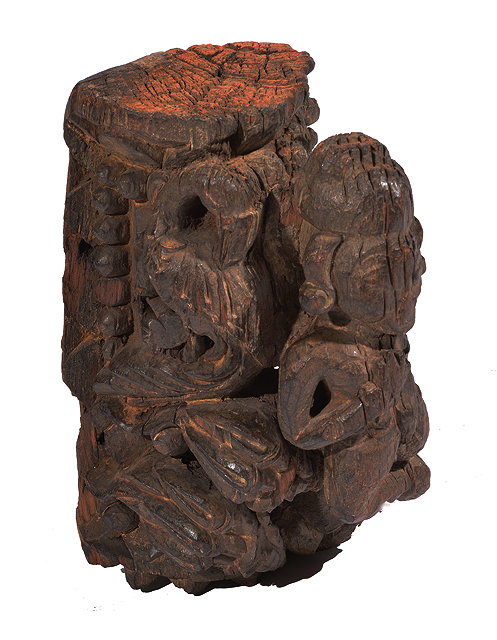 Appraisal: A CARVED INDIAN HARDWOOD ARCHITECTURAL ELEMENT depicting a deity cm