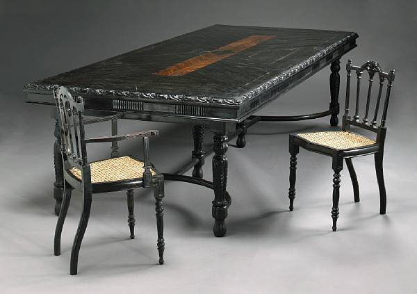 Appraisal: A Dutch Colonial ebony dining suite Comprising a dining table