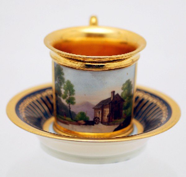 Appraisal: Scenic cup and saucer cup with gilt decoration on cobalt