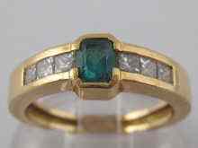 Appraisal: A yellow metal tests carat gold emerald and diamond ring