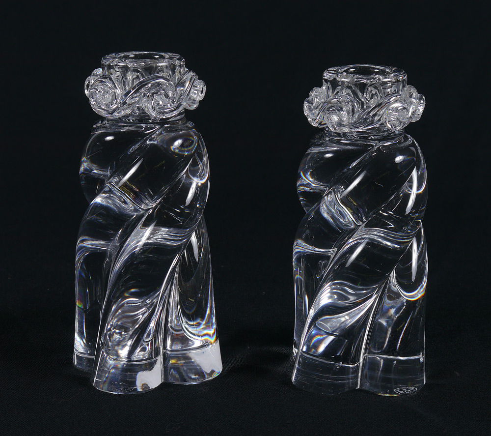 Appraisal: PAIR BACCARAT CRYSTAL CANDLE STANDS Scroll wave decoration at top