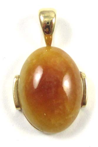 Appraisal: RED JADE AND FOURTEEN KARAT GOLD PENDANT with a red