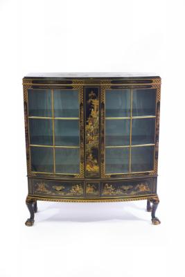 Appraisal: A chinoiserie display cabinet of bowfront form enclosed by glazed