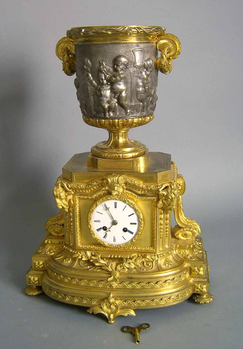 Appraisal: French gilt bronze mantle clock ca with porcelain face and