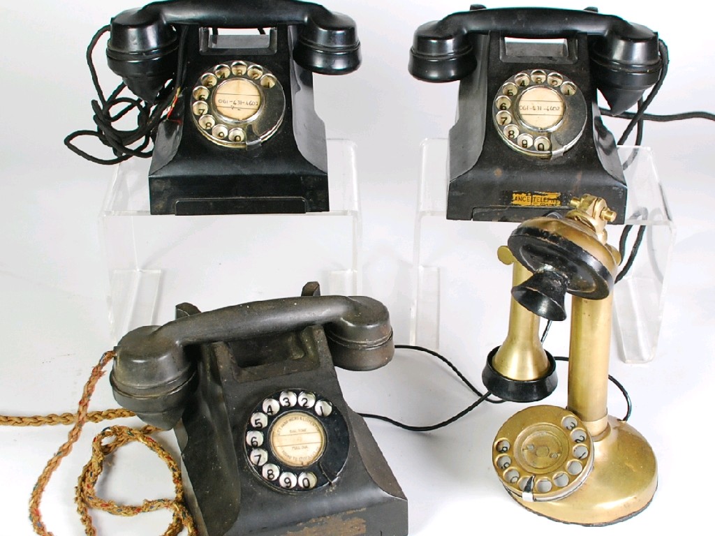 Appraisal: THREE OLD BAKELITE TELEPHONES AND A BRASS CANDLESTICK DITTO