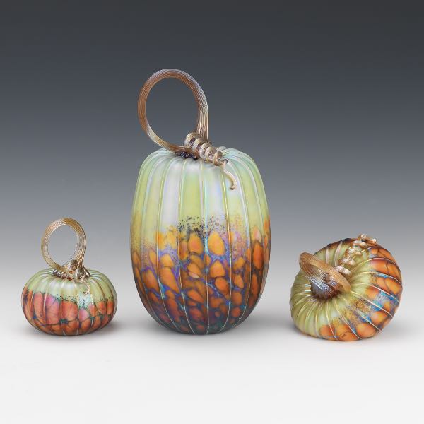 Appraisal: JACK PINE AMERICAN CONTEMPORARY Three glass pumpkins in Green Orchard