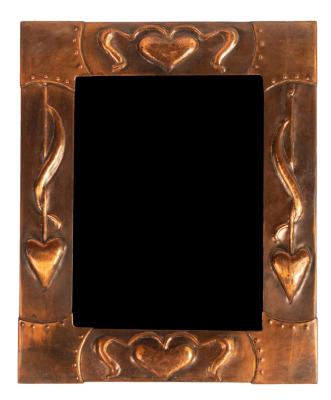 Appraisal: An Arts Crafts style copper mirror the frame embossed heart