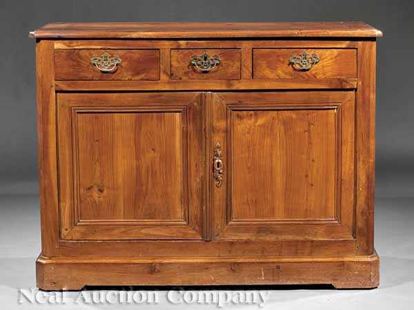 Appraisal: A Louis Philippe Fruitwood Buffet Bas th c molded top