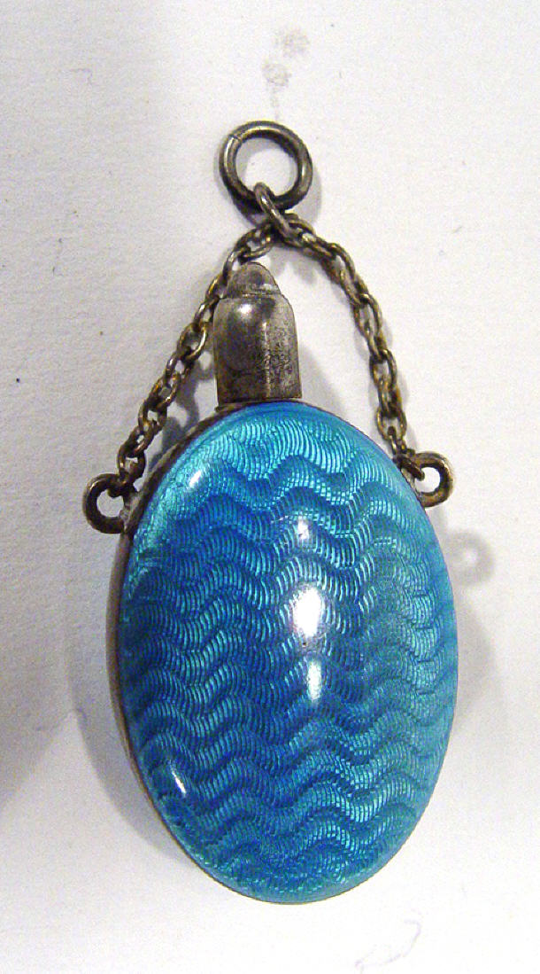 Appraisal: Oval silver metal blue enamelled scent bottle with chain cm