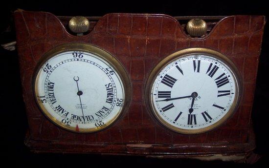 Appraisal: An Asprey Co watch and aneroid barometer both set within