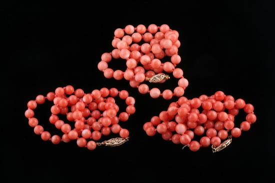 Appraisal: THREE CHINESE CORAL BEAD NECKLACES Each with k yellow gold