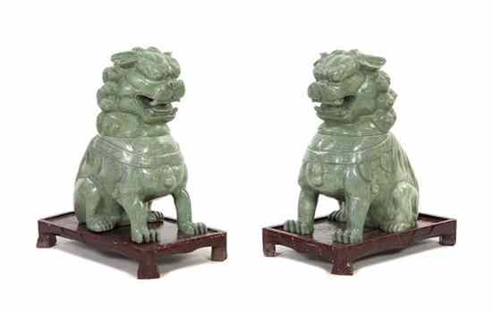 Appraisal: A Pair of Hardstone Fu Dog Form Vessels the modeled