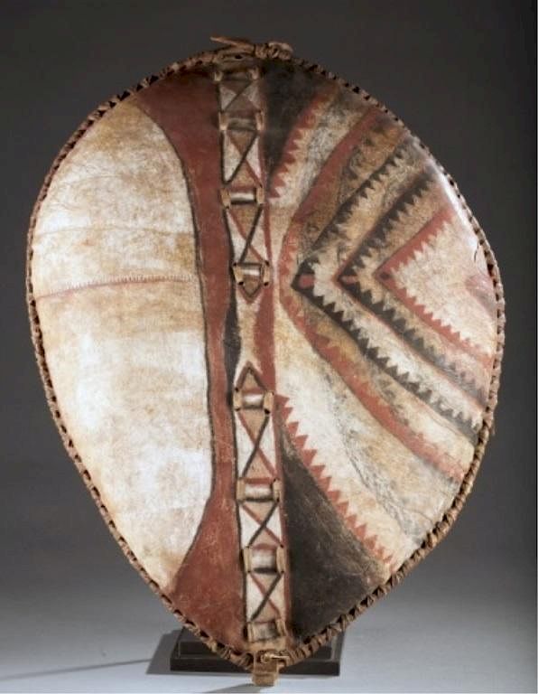 Appraisal: Masai hide shield th c A polychrome hide shield Kenya