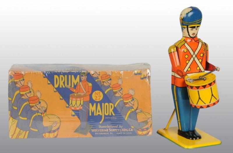 Appraisal: Tin Wolverine Drum Major Wind-Up Toy Description American Working Largest