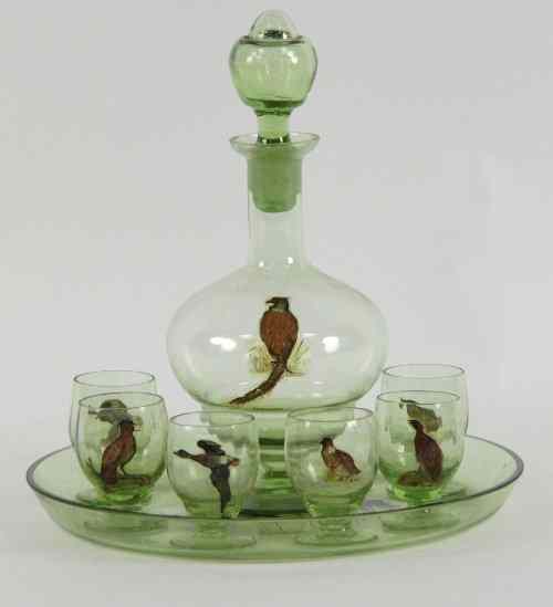 Appraisal: A green glass spirit decanter six shot glasses and a