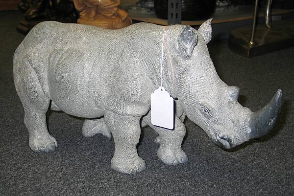 Appraisal: A carved stone group of a rhinoceros and her young