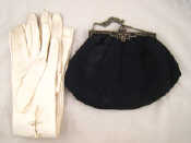 Appraisal: A lady's black evening bag the silver frame and clasp