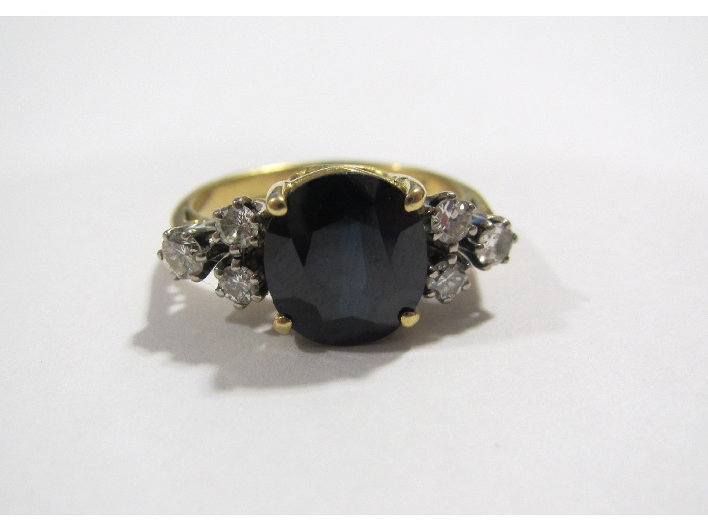 Appraisal: An eighteen carat gold sapphire and diamond set dress ring