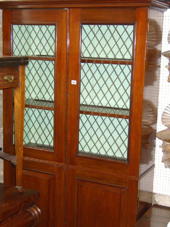 Appraisal: A Regency style mahogany bookcase of full height the lower